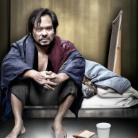 Realistic photo of dingdong dantes as homeless